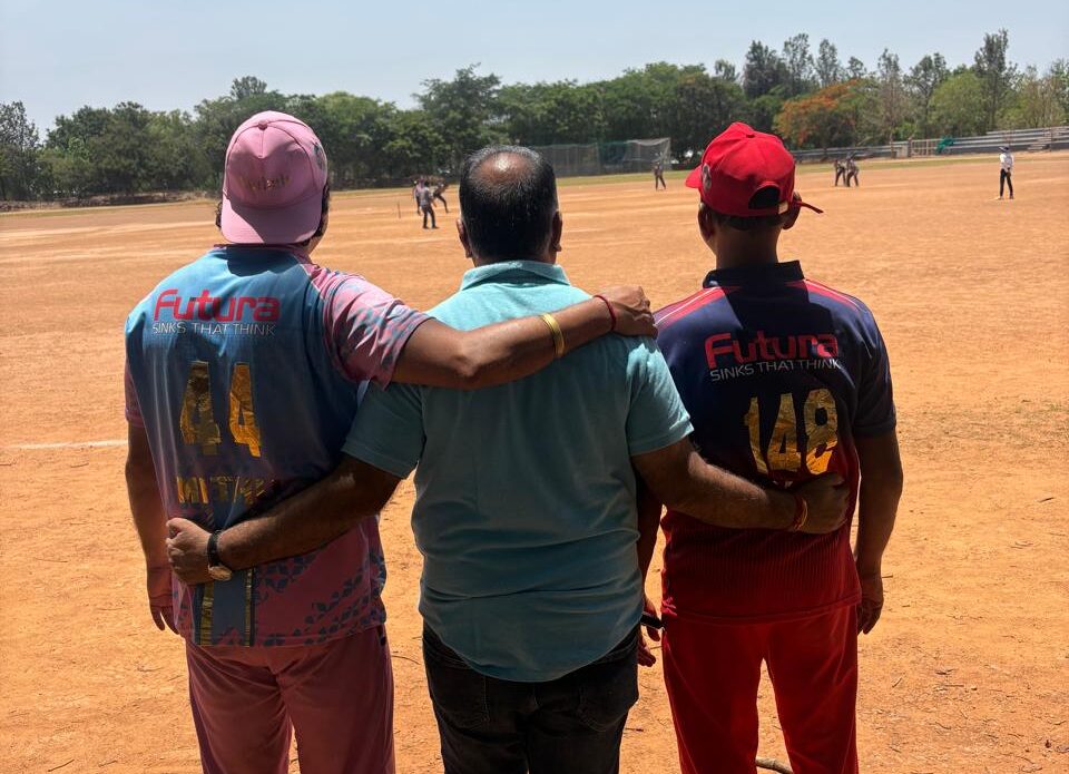 Futura Kitchen Sinks India Pvt Ltd sponsored players standing together at a Jain community cricket tournament organized by Siwanchi Jain Yuva Mandal in Bangalore.